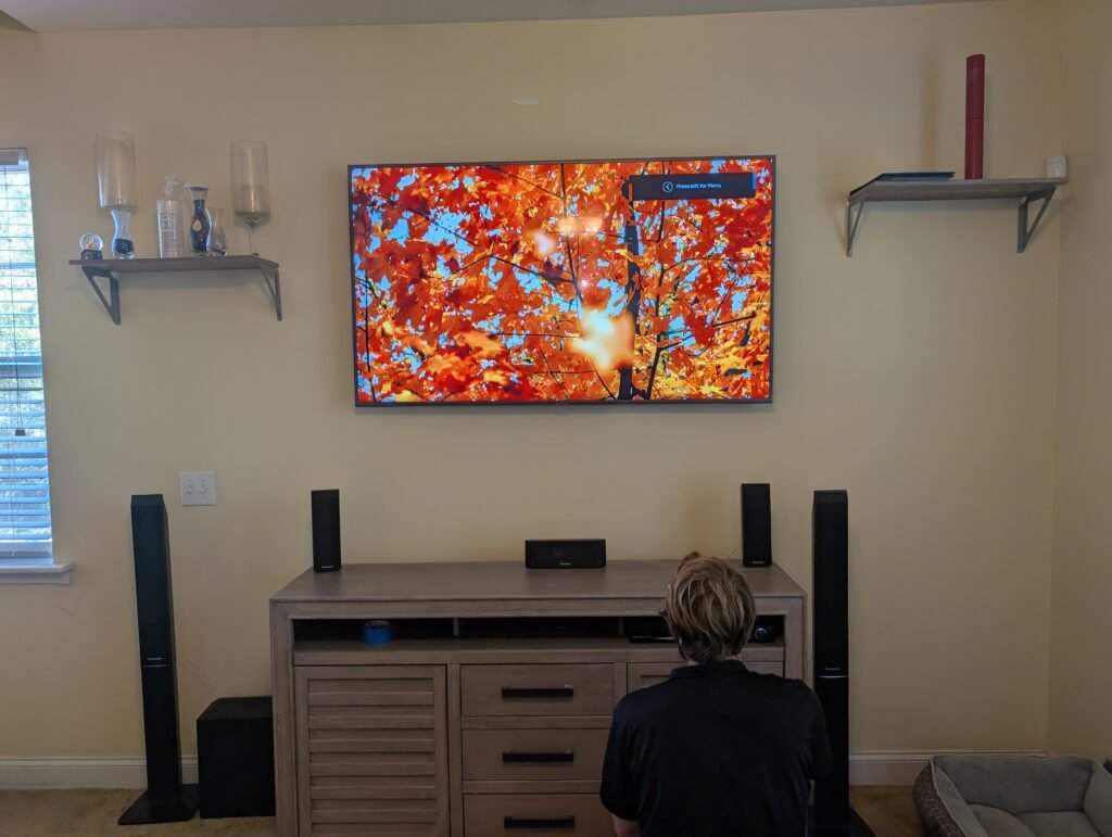 mounted TV with soundbar and organized cables, showing clean home setup